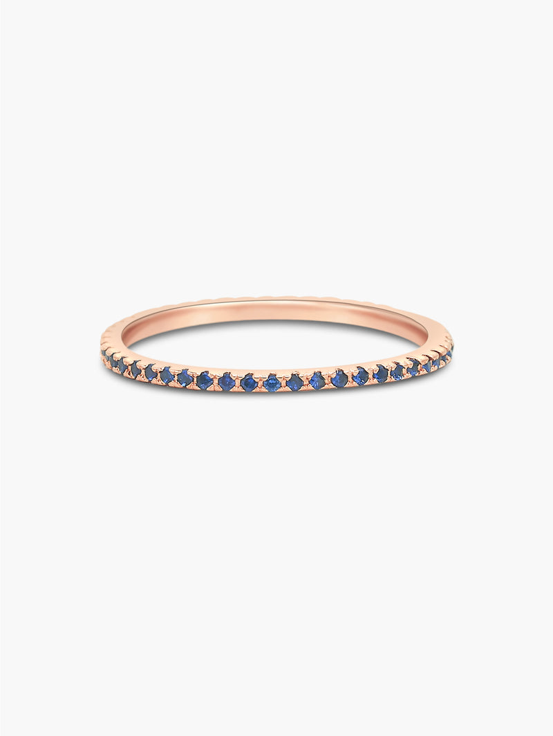 rose gold eternity band with sapphire stones