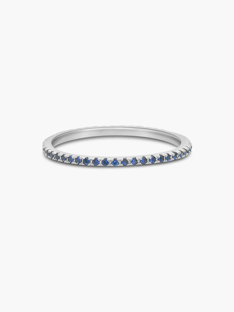 silver eternity band with sapphire stones