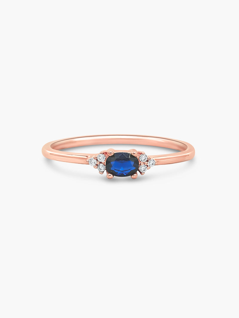rose gold oval ring with blue stones